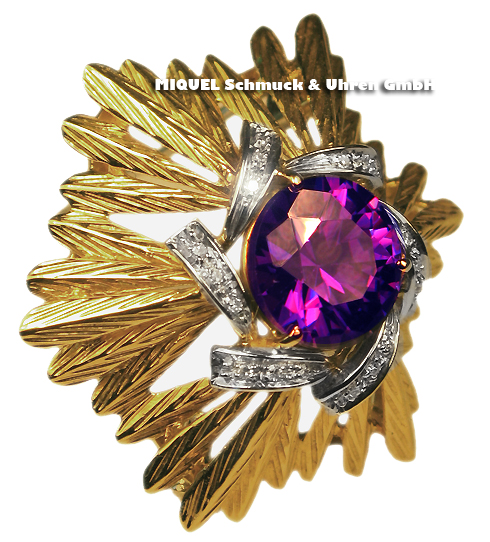 Gold brooch with purple stone and diamonds